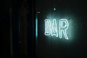 photo of turn-on white bar neon sign by Alex Knight 